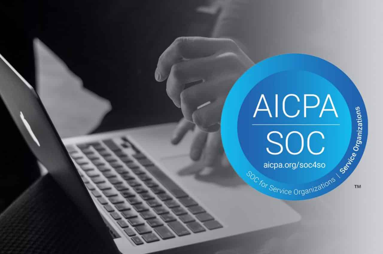 image of hands on a laptop with AICPA SOC logo