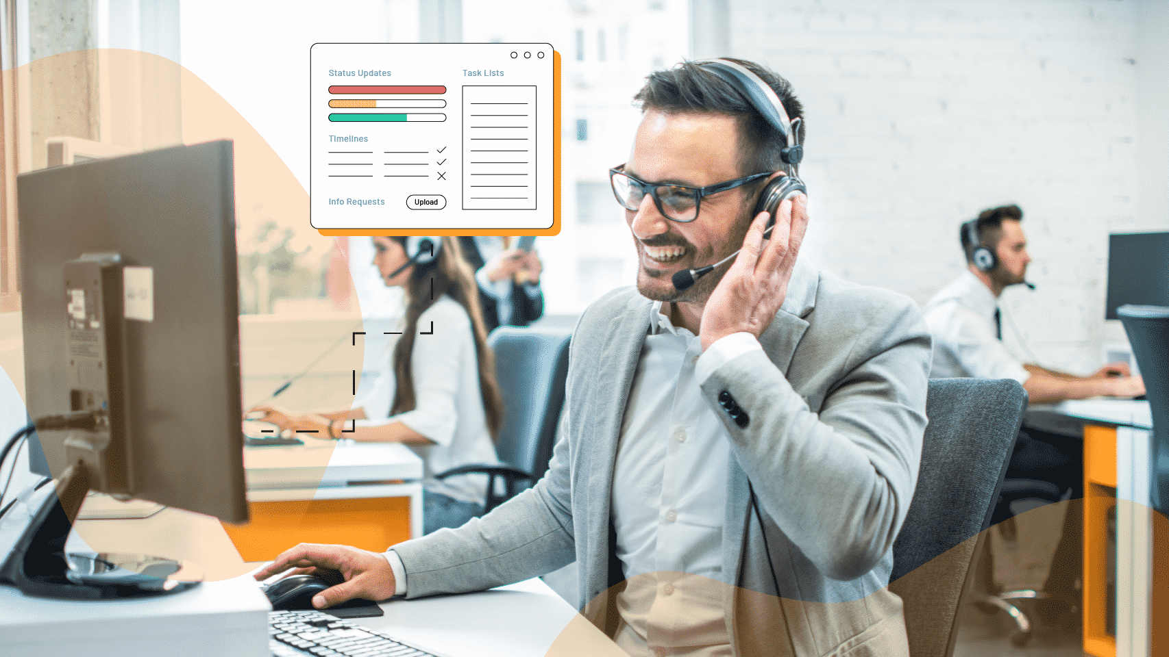 man on his computer smiling while using a phone headset