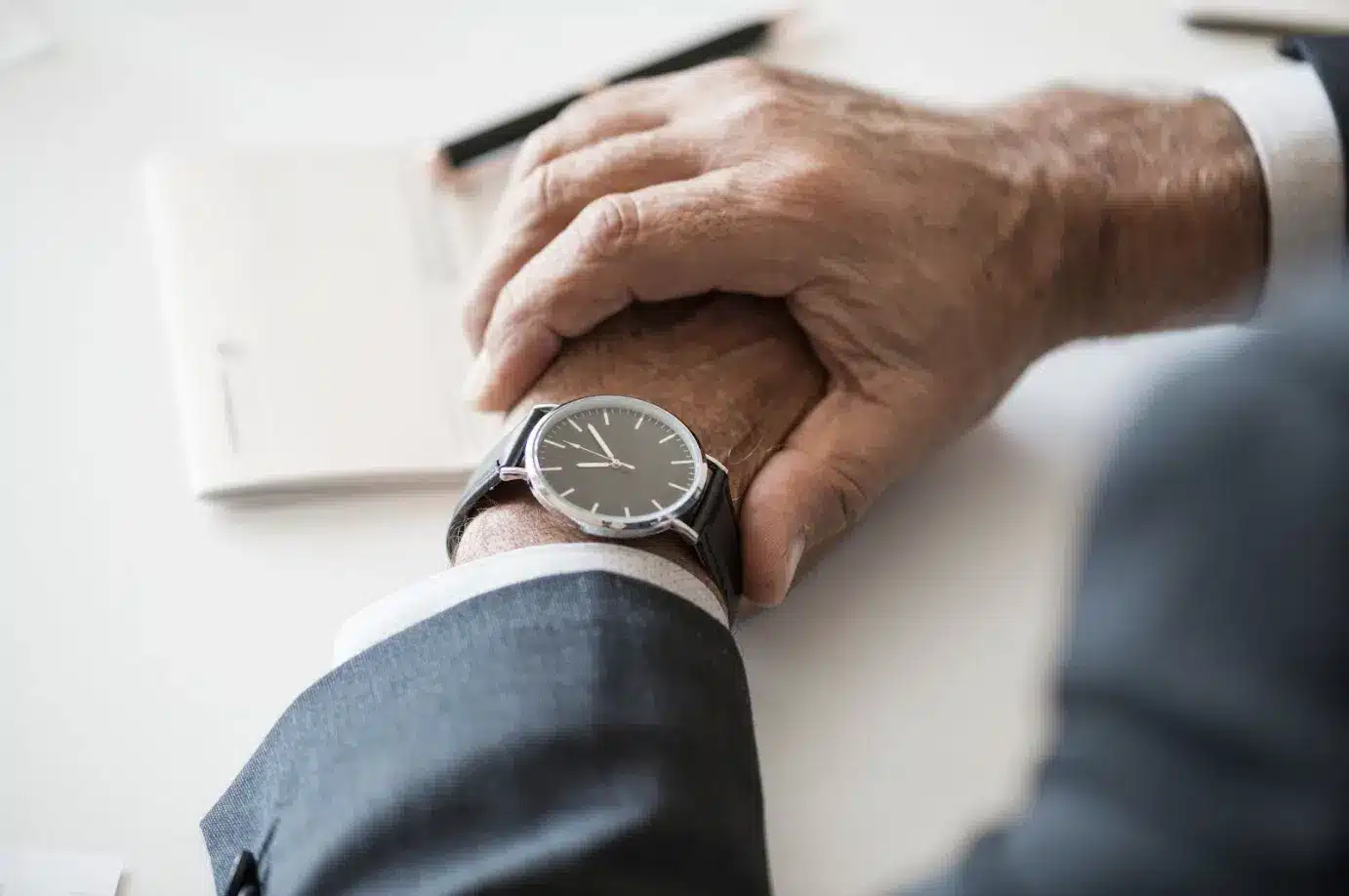 businessman looking at wrist watch