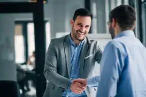 Two men shaking their hands