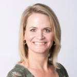 blonde shoulder length hair female from shoulders up smiling