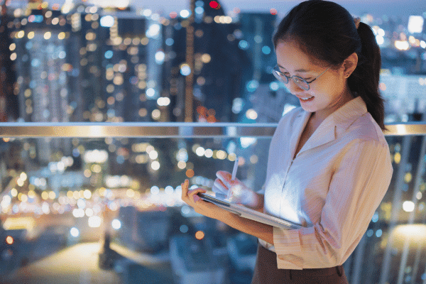 Business woman looking at a tablet