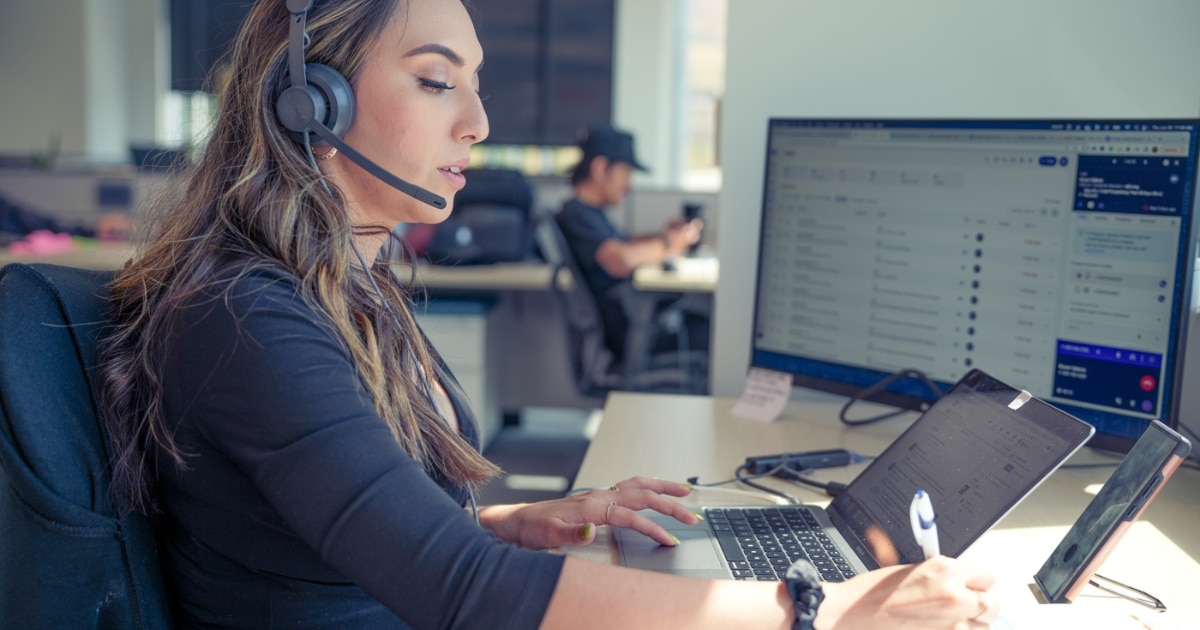 customer success person sits at desk